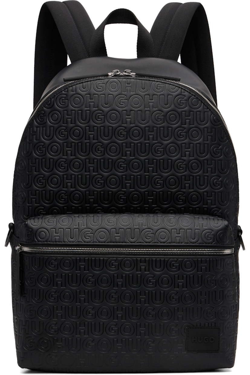 Buffed faux-leather backpack.

· Logo pattern embossed throughout
· Fixed carry handle
· Adjustable padded shoulder straps
· Rubberized logo patch and zip pocket at face
· D-ring at sides
· Padded panel at back face
· Two-way zip closure
· Zip pocket and laptop compartment at interior
· H16.5" x W14" x D5.5"

Supplier color: Black