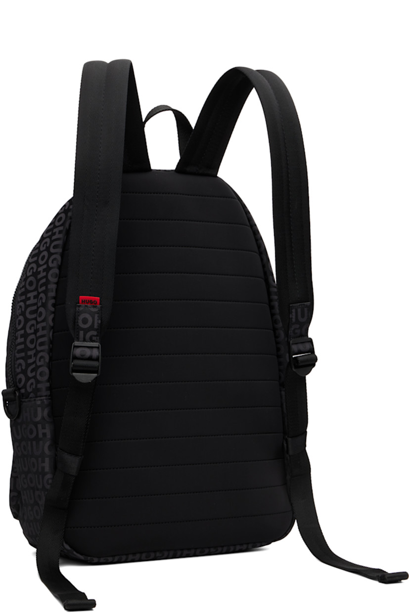 Taffeta backpack.

· Jacquard logo pattern throughout
· Fixed carry handle
· Adjustable padded shoulder straps
· Rubberized logo patch and zip pocket at face
· D-ring at sides
· Padded panel at back face
· Two-way zip closure
· Zip pocket and laptop compartment at interior
· H16.5" x W14" x D5.5"

Supplier color: Black