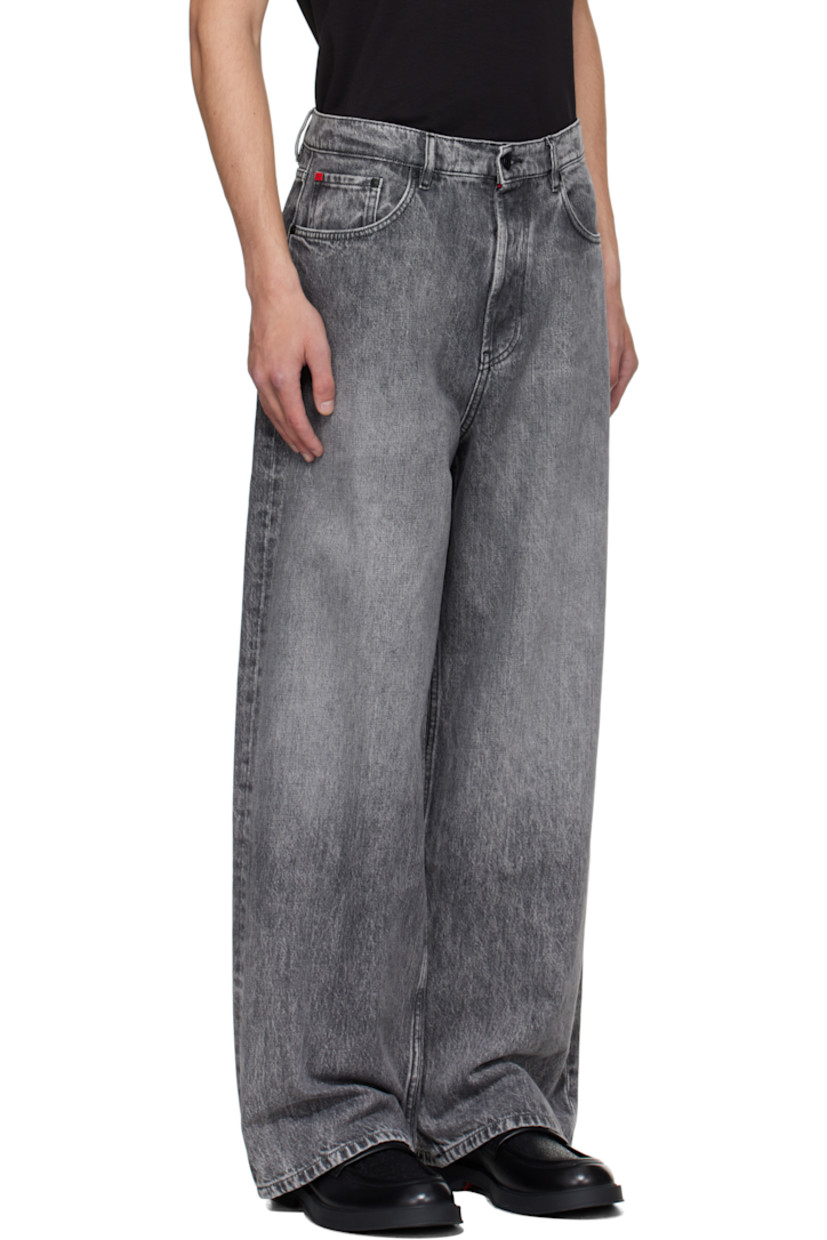 Non-stretch denim jeans.

· Fading throughout
· Belt loops
· Five-pocket styling
· Button fly
· Logo plaque at coin pocket
· Leather logo patch at back waistband
· Logo-engraved black hardware

Supplier color: Dark grey