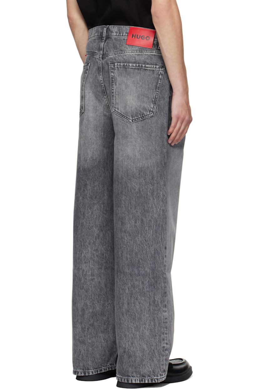 Non-stretch denim jeans.

· Fading throughout
· Belt loops
· Five-pocket styling
· Button fly
· Logo plaque at coin pocket
· Leather logo patch at back waistband
· Logo-engraved black hardware

Supplier color: Dark grey