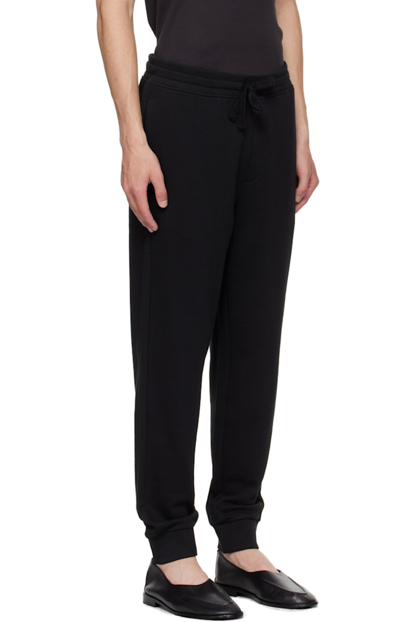 Cotton French terry sweatpants.

· Mid-rise
· Drawstring at elasticized rib-knit waistband
· Two-pocket styling
· Logo bonded at leg
· Rib-knit cuffs

Supplier color: Black