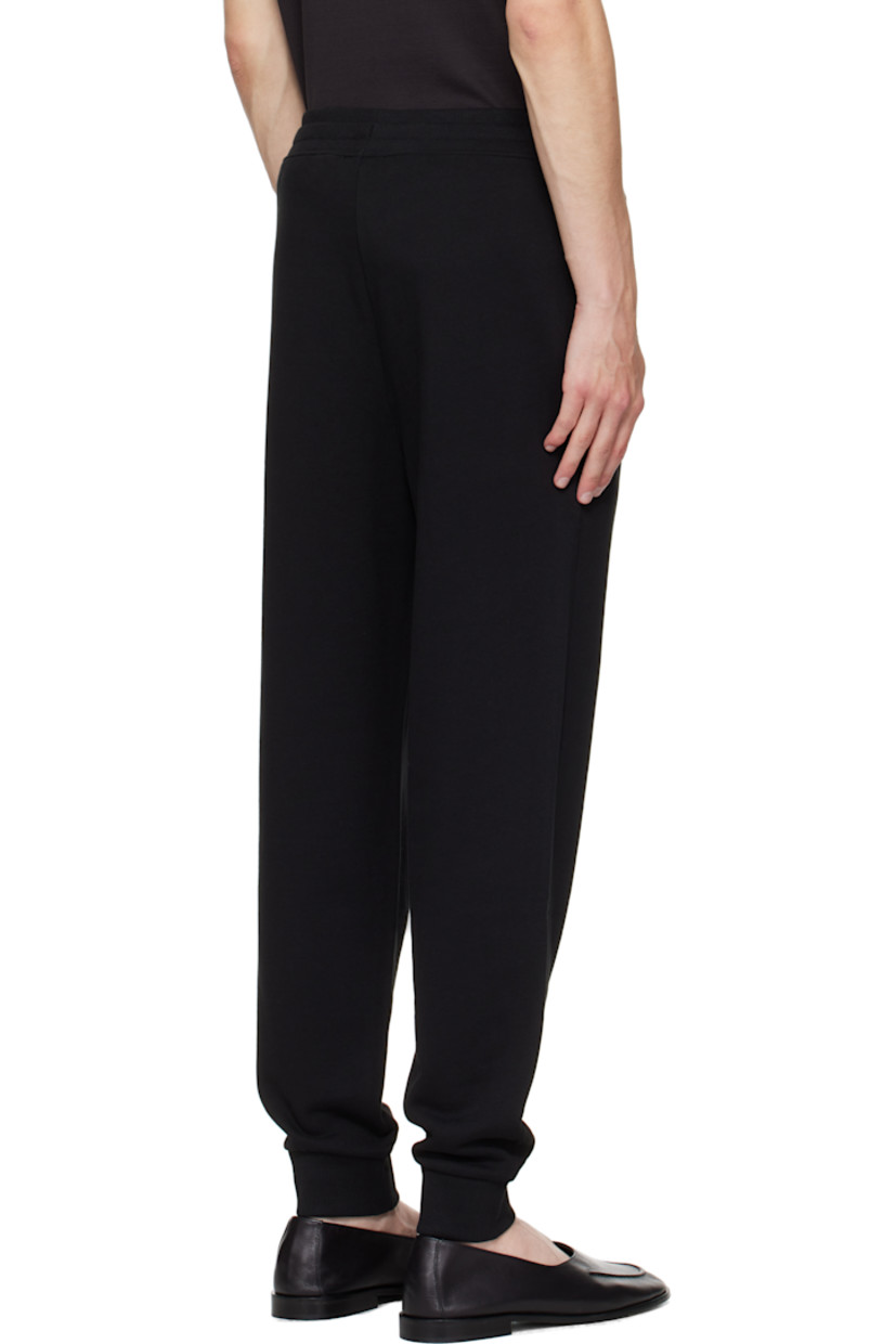 Cotton French terry sweatpants.

· Mid-rise
· Drawstring at elasticized rib-knit waistband
· Two-pocket styling
· Logo bonded at leg
· Rib-knit cuffs

Supplier color: Black