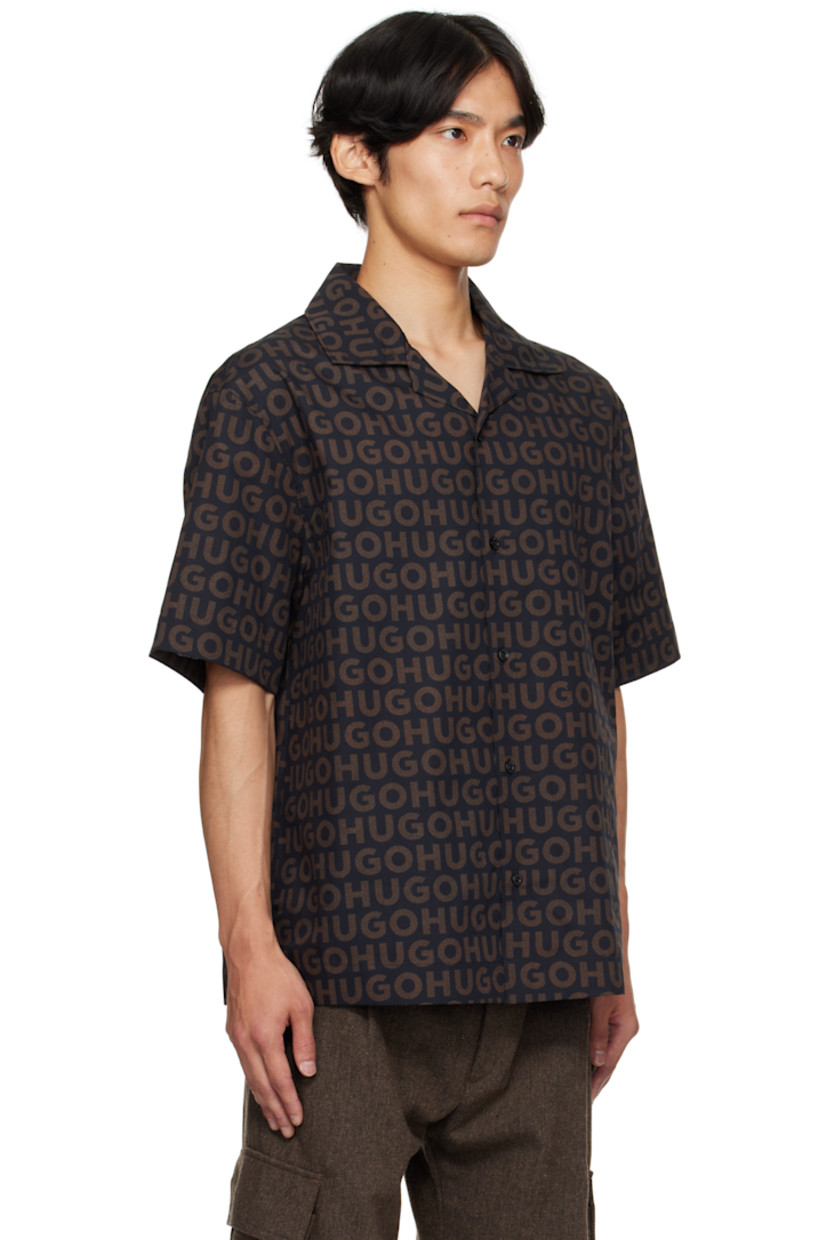 Oversized cotton poplin shirt.

· Printed logo pattern throughout
· Open spread collar
· Button closure
· Logo-engraved hardware

Supplier color: Brown