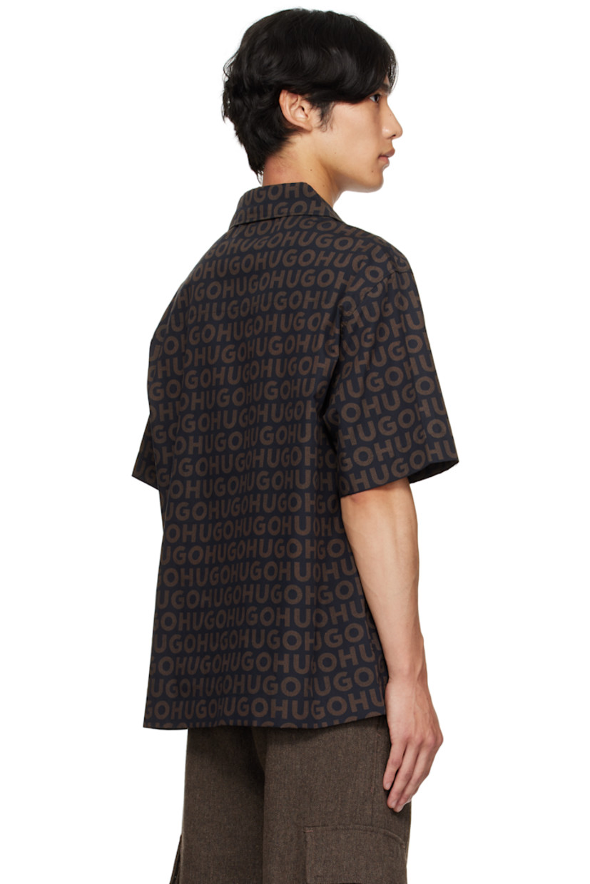 Oversized cotton poplin shirt.

· Printed logo pattern throughout
· Open spread collar
· Button closure
· Logo-engraved hardware

Supplier color: Brown