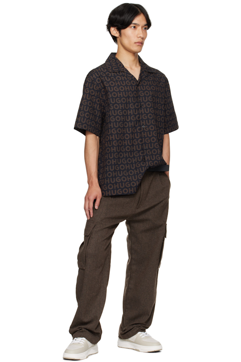 Oversized cotton poplin shirt.

· Printed logo pattern throughout
· Open spread collar
· Button closure
· Logo-engraved hardware

Supplier color: Brown