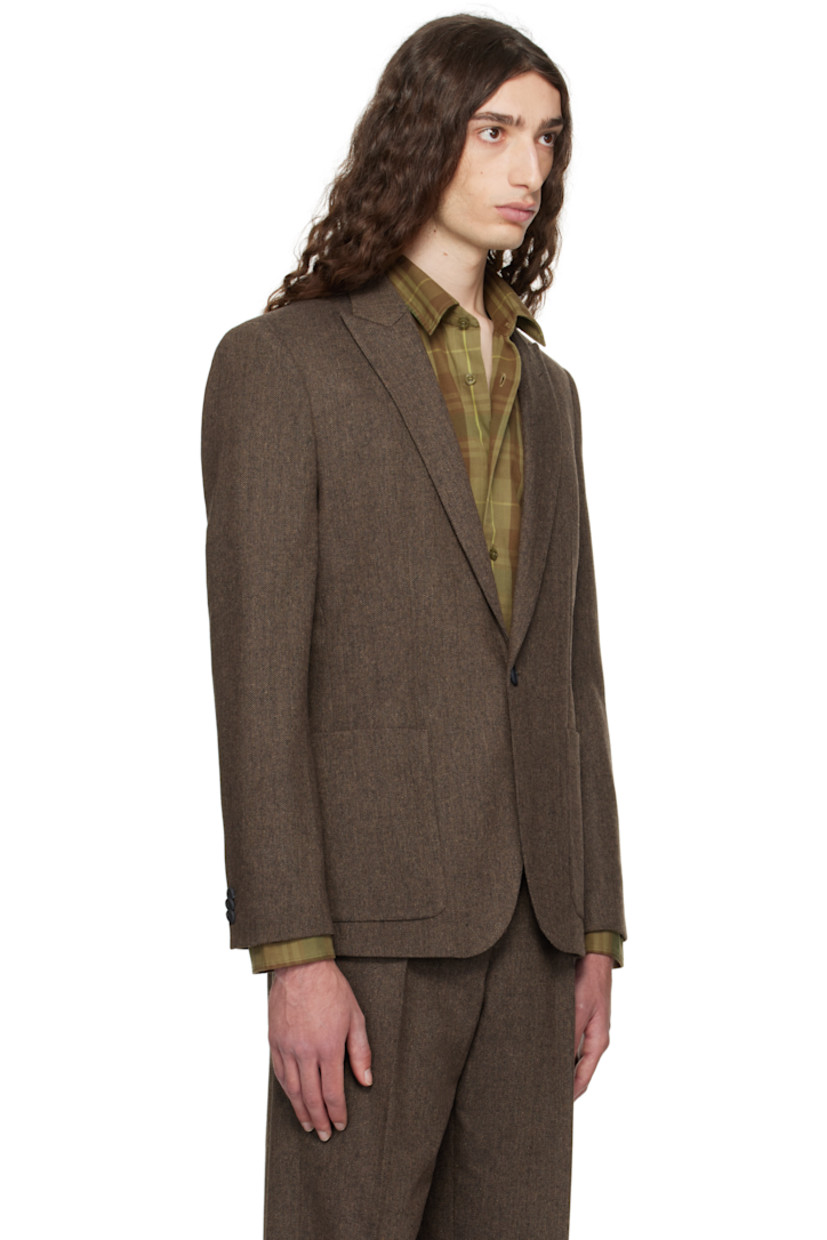 Wool- and recycled cotton-blend herringbone blazer.

· Peaked lapel
· Darts at waist
· Patch pockets at waist
· Button closure
· Twin vents at back hem
· Buttoned surgeon's cuffs
· Welt pocket at interior
· Full satin lining

Supplier color: Medium brown