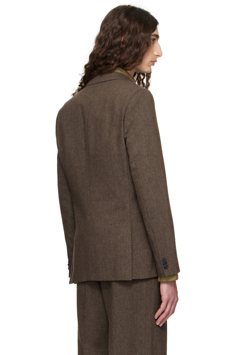 Wool- and recycled cotton-blend herringbone blazer.

· Peaked lapel
· Darts at waist
· Patch pockets at waist
· Button closure
· Twin vents at back hem
· Buttoned surgeon's cuffs
· Welt pocket at interior
· Full satin lining

Supplier color: Medium brown