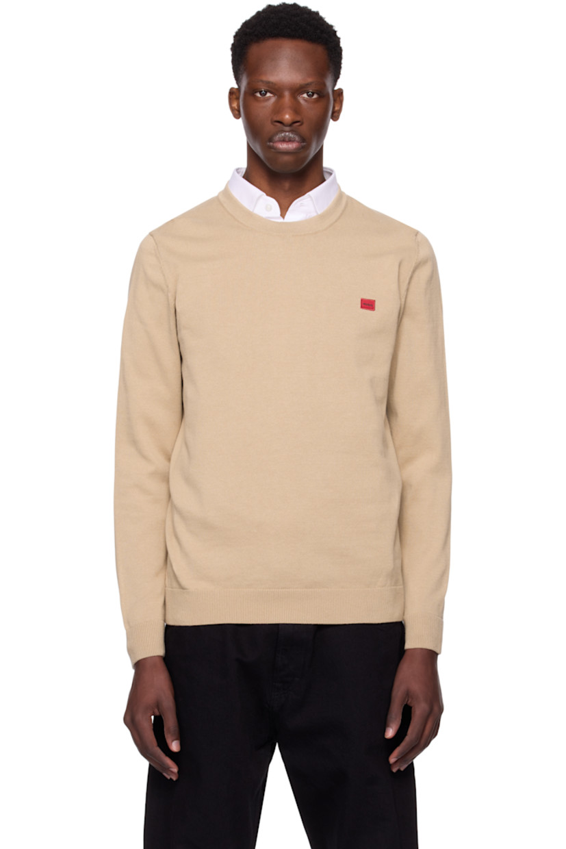 Knit cotton sweater. 

· Rib-knit crewneck, hem, and cuffs
· Embroidered logo patch at chest 

Supplier color: Medium beige
