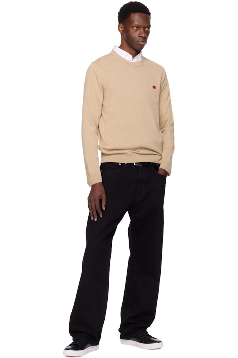 Knit cotton sweater. 

· Rib-knit crewneck, hem, and cuffs
· Embroidered logo patch at chest 

Supplier color: Medium beige