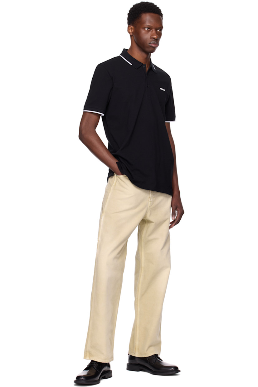 Stretch cotton piqué polo. 

· Striped rib-knit spread collar and cuffs
· Three-button placket
· Logo bonded at chest
· Tennis-tail hem 

Supplier color: Black