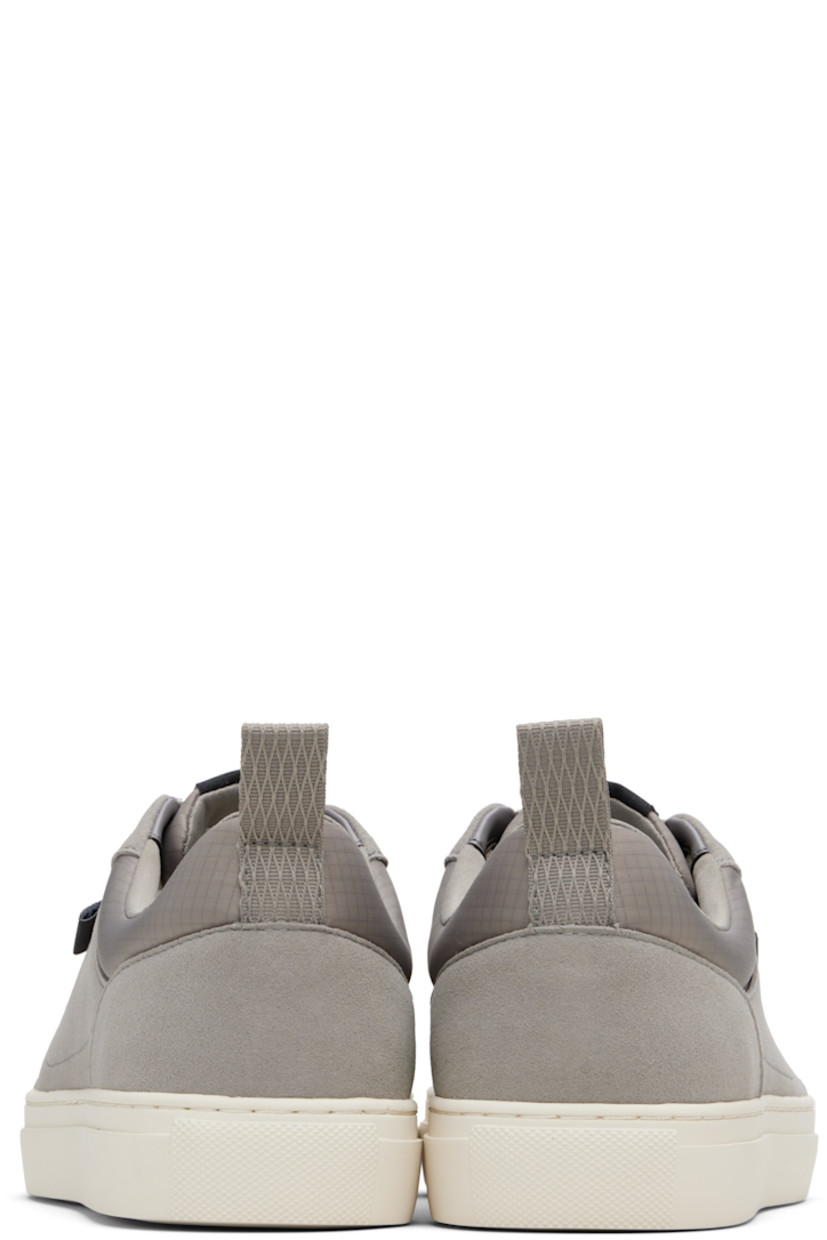 Low-top faux-suede sneakers.

· Lace-up closure
· Logo patch at tongue
· Padded ripstop tongue and collar
· Logo flag at outer side
· Pull-loop at heel tab
· Treaded rubber sole

Supplier color: Open grey