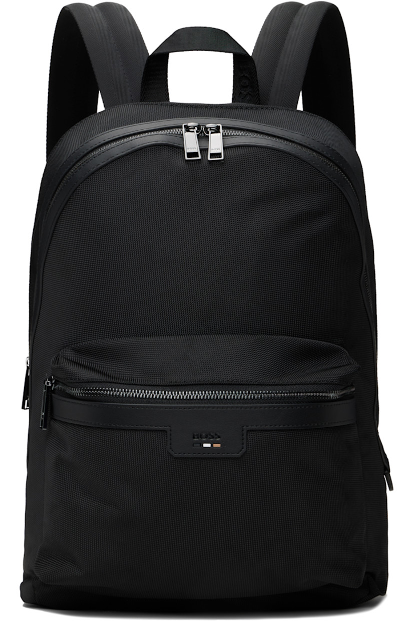 Canvas backpack in black.

· Buffed faux-leather trim throughout
· Logo-woven carry handle
· Adjustable padded shoulder straps
· Embossed logo and tricolor stripe appliqué at face
· Zip pocket at face
· Luggage strap at padded mesh back face
· Two-way zip closure
· Zip pocket and patch pockets at interior
· Padded laptop compartment
· Logo-woven satin lining 
· Logo-engraved gunmetal-tone hardware
· H15" x W12" x D6"

Supplier color: Black