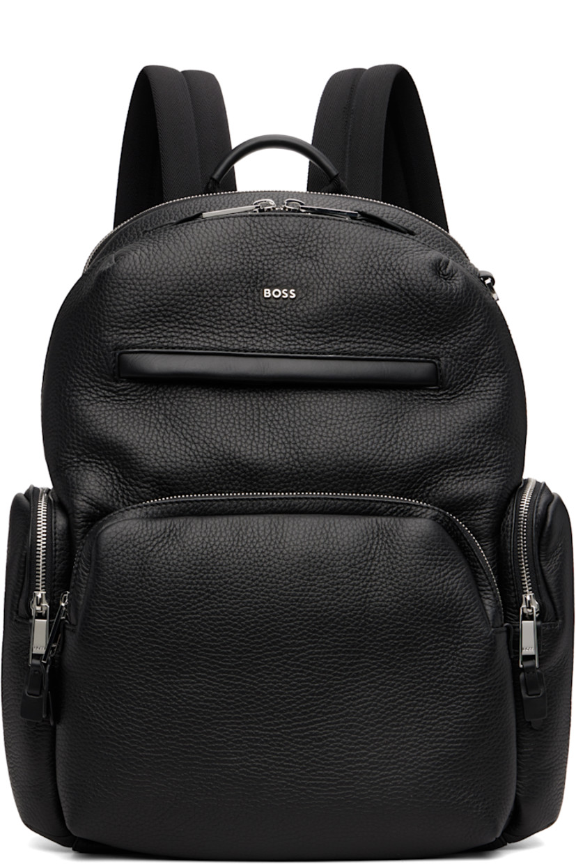 Grained leather backpack.

· Fixed carry handle
· Adjustable padded shoulder straps
· D-ring at top
· Logo hardware at face
· Zip pockets at face and sides
· Padded mesh panel at back face
· Luggage strap at back face
· Two-way zip closure
· Zip and patch pocket at interior
· Laptop compartment
· H17" x W14" x D7"

Supplier color: Black