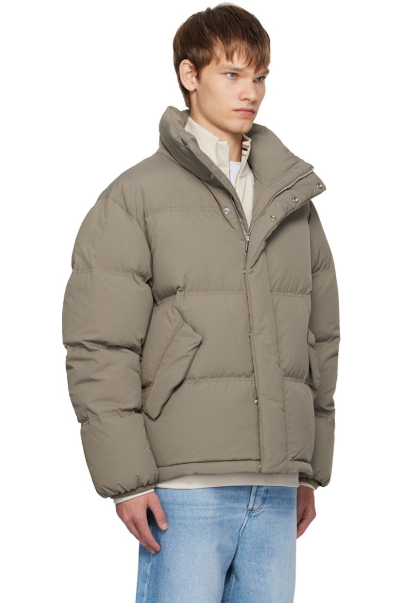 Down-filled and quilted recycled nylon taffeta jacket.

· Stand collar
· Zip closure with press-stud placket
· Flap pockets at front
· Bungee-style drawstring at hem
· Logo patch at sleeve
· Rib-knit cuffs
· Zip pocket at interior
· Full satin lining

Supplier color: Light brown

Fill: 80% duck down, 20% duck feather.