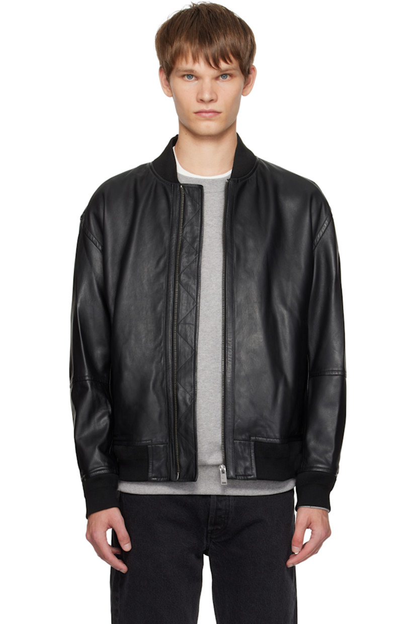 Grained leather jacket.

· Rib-knit stand collar, hem, and cuffs
· Zip closure
· Zip pockets at front
· Logo hardware at back collar
· Welt pocket at interior
· Full satin lining

Supplier color: Black
