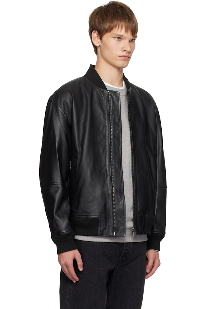 Grained leather jacket.

· Rib-knit stand collar, hem, and cuffs
· Zip closure
· Zip pockets at front
· Logo hardware at back collar
· Welt pocket at interior
· Full satin lining

Supplier color: Black