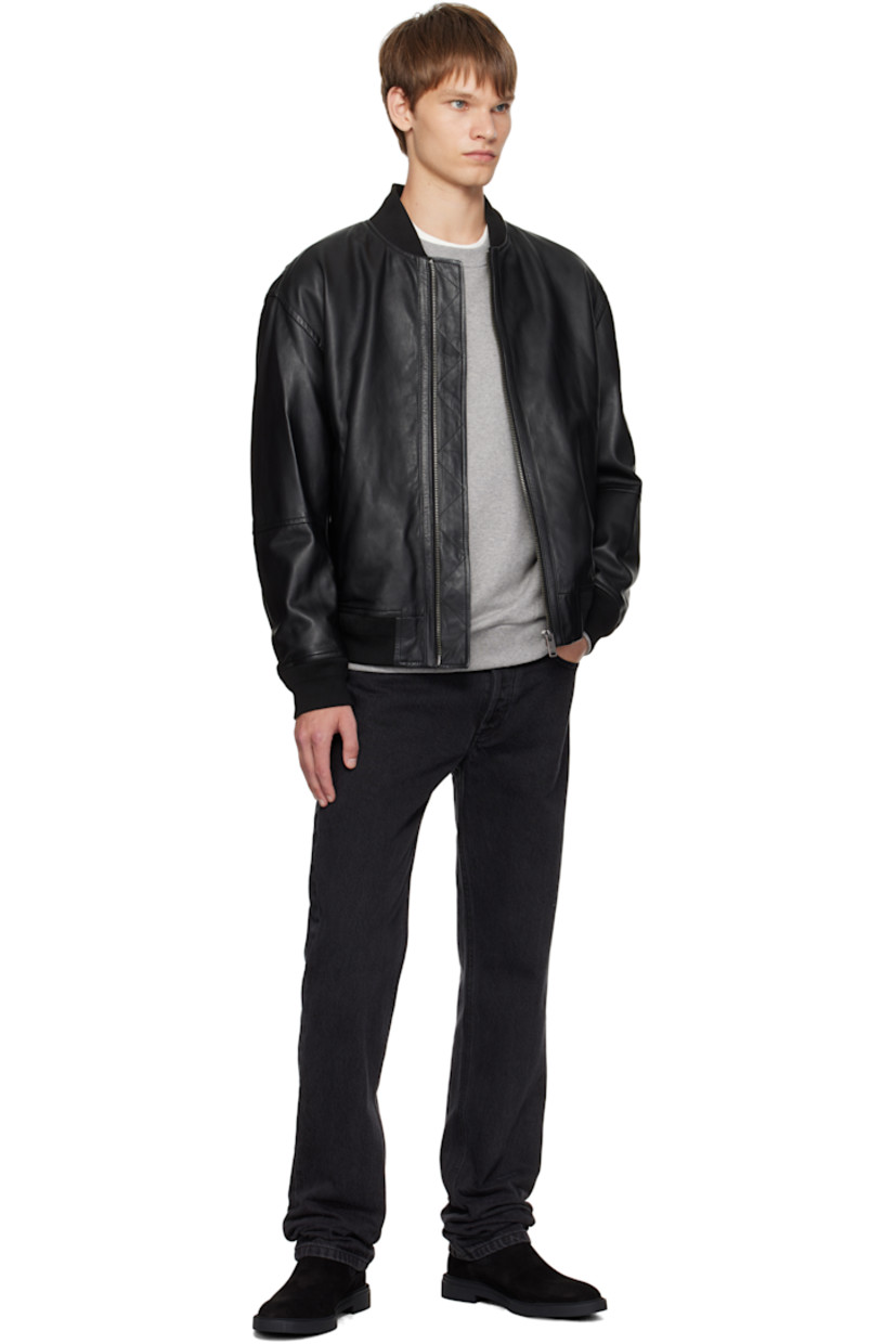 Grained leather jacket.

· Rib-knit stand collar, hem, and cuffs
· Zip closure
· Zip pockets at front
· Logo hardware at back collar
· Welt pocket at interior
· Full satin lining

Supplier color: Black