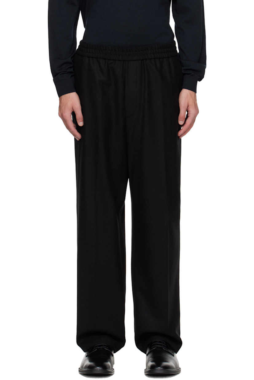 Wool-blend melton trousers.

· Tapered 
· Elasticized waistband
· Three-pocket styling
· Zip fly

Supplier color: Black