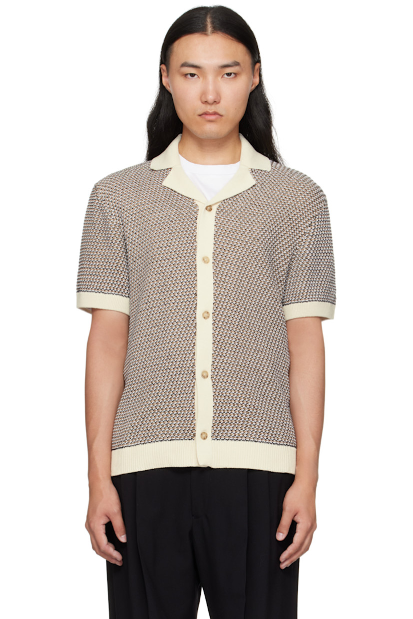 Textured-knit cotton shirt.

· Rib-knit open spread collar, hem, and cuffs
· Button closure

Supplier color: White