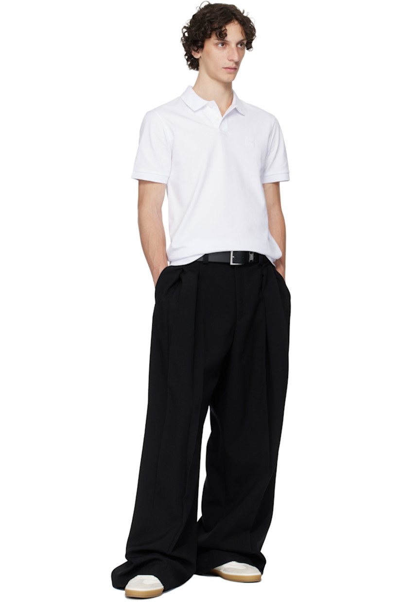 Stretch cotton piqué polo.

· Rib-knit spread collar and cuffs
· Two-button placket
· Logo patch at chest

Supplier color: White