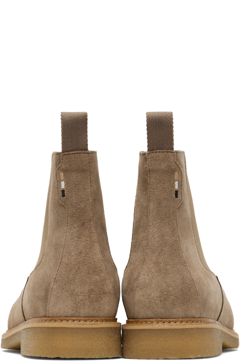 Ankle-high faux-suede Chelsea boots.

· Elasticized gusset at sides
· Woven pull-loop at heel collar
· Topstitching at welt
· Treaded crêpe rubber sole

Supplier color: Beige