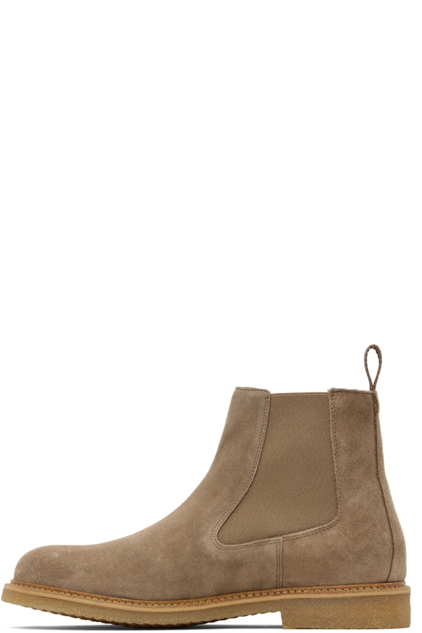 Ankle-high faux-suede Chelsea boots.

· Elasticized gusset at sides
· Woven pull-loop at heel collar
· Topstitching at welt
· Treaded crêpe rubber sole

Supplier color: Beige