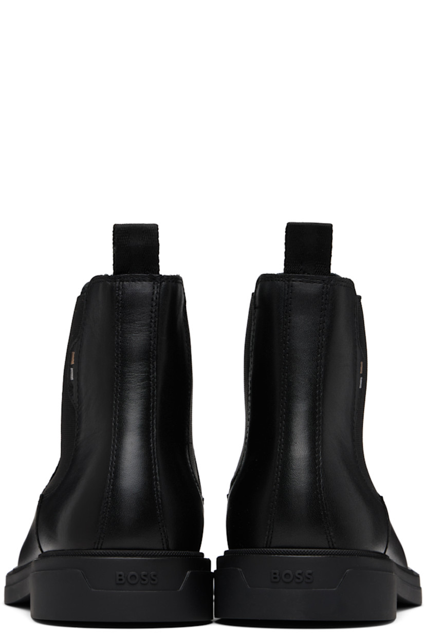 Ankle-high grained nappa leather Chelsea boots. 

· Elasticized gusset at sides
· Logo stripes embroidered at outer side
· Pull-loop at heel collar
· Logo embossed at heel
· Grained leather lining
· Treaded rubber sole

Supplier color: Black