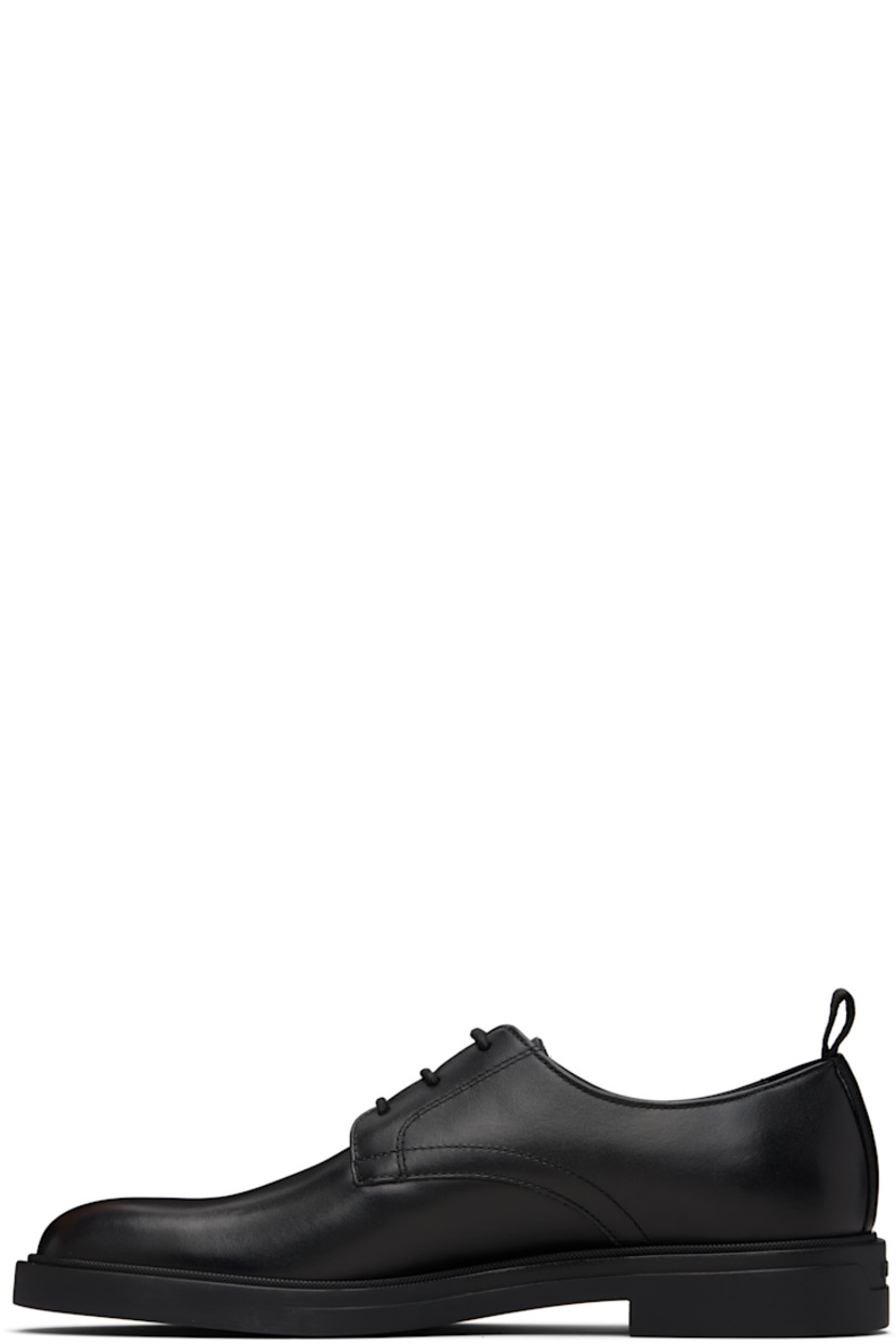 Buffed leather derbys.

· Lace-up closure
· Pull-loop at heel collar
· Logo embossed at heel
· Suede and grained leather lining
· Treaded rubber sole

Supplier color: Black