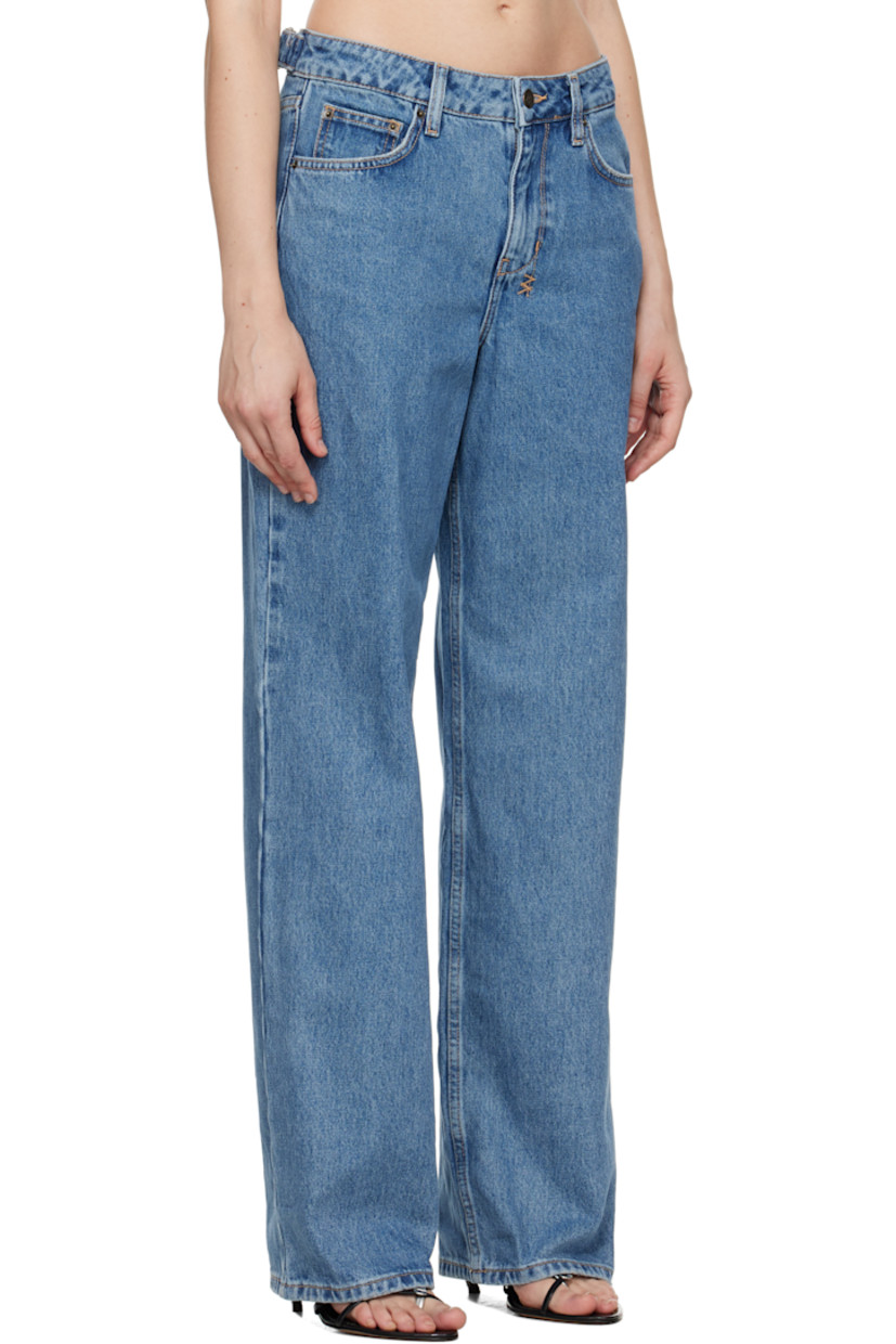 Non-stretch denim jeans.

· Fading and subtle distressing throughout
· Loose straight-leg
· Low-rise
· Belt loops
· Five-pocket styling
· Zip fly
· Adjustable cinch tabs at back waistband
· Logos embroidered at back waistband and leg
· Logo-engraved antiqued brass-tone hardware
· Contrast stitching in beige

Supplier color: Heritage