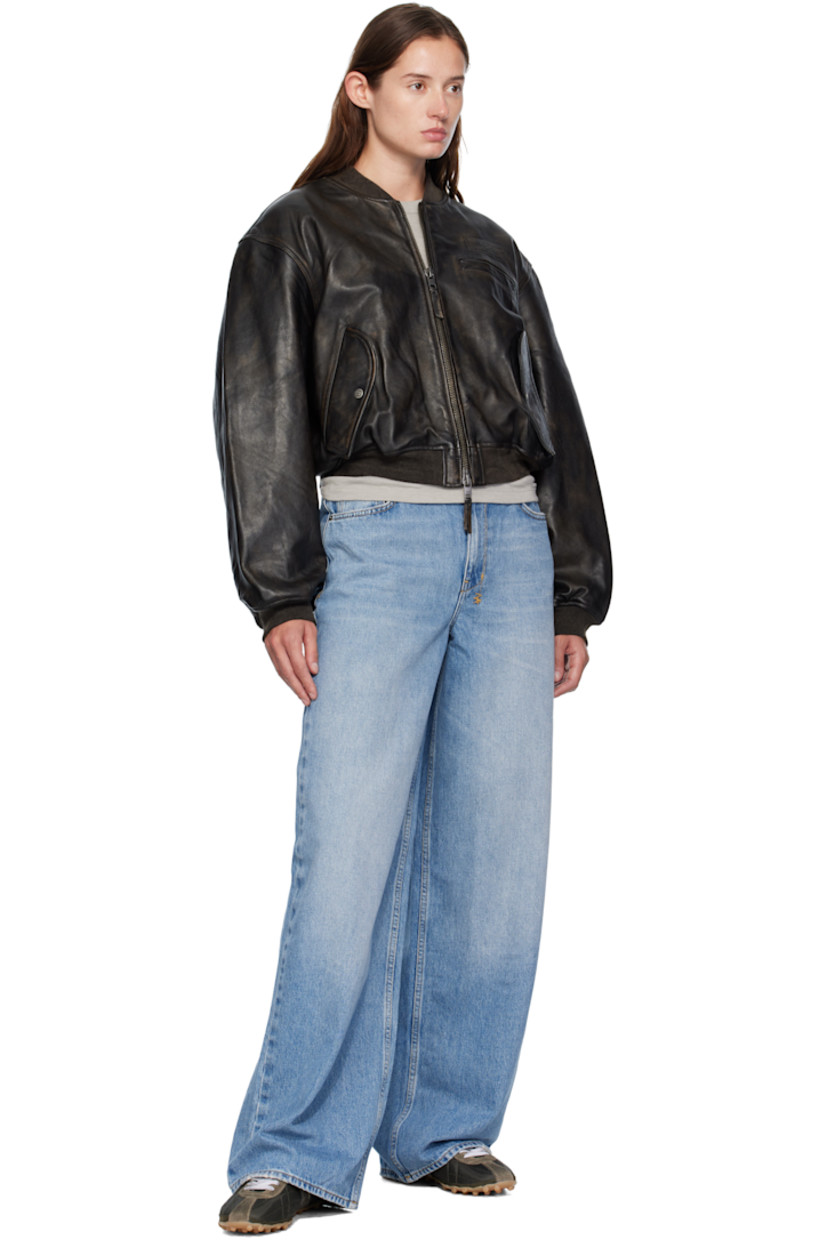 Non-stretch denim jeans.

· Fading, whiskering, and subtle distressing throughout
· Belt loops
· Five-pocket styling
· Zip fly 
· Embroidered logos at back waist and knee
· Detachable logo patch at back pocket
· Contrast stitching in tan

Supplier color: Denim