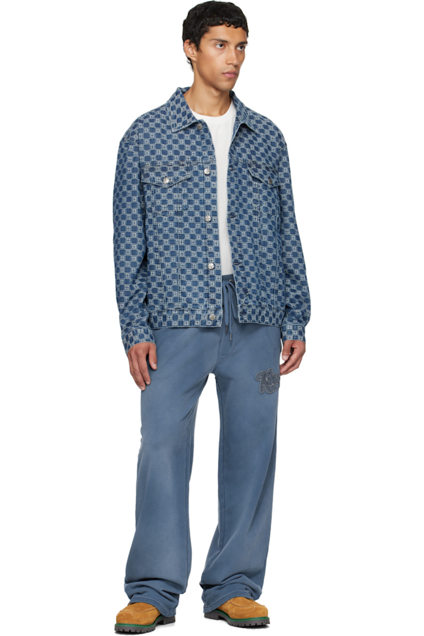 Non-stretch denim jacket. 

· Jacquard logo pattern throughout
· Spread collar 
· Button closure
· Flap pockets at chest
· Buttoned barrel cuffs
· Embroidered logos at back
· Adjustable buttoned tabs at back hem 
· Logo-engraved antiqued silver-tone hardware

Supplier color: Denim