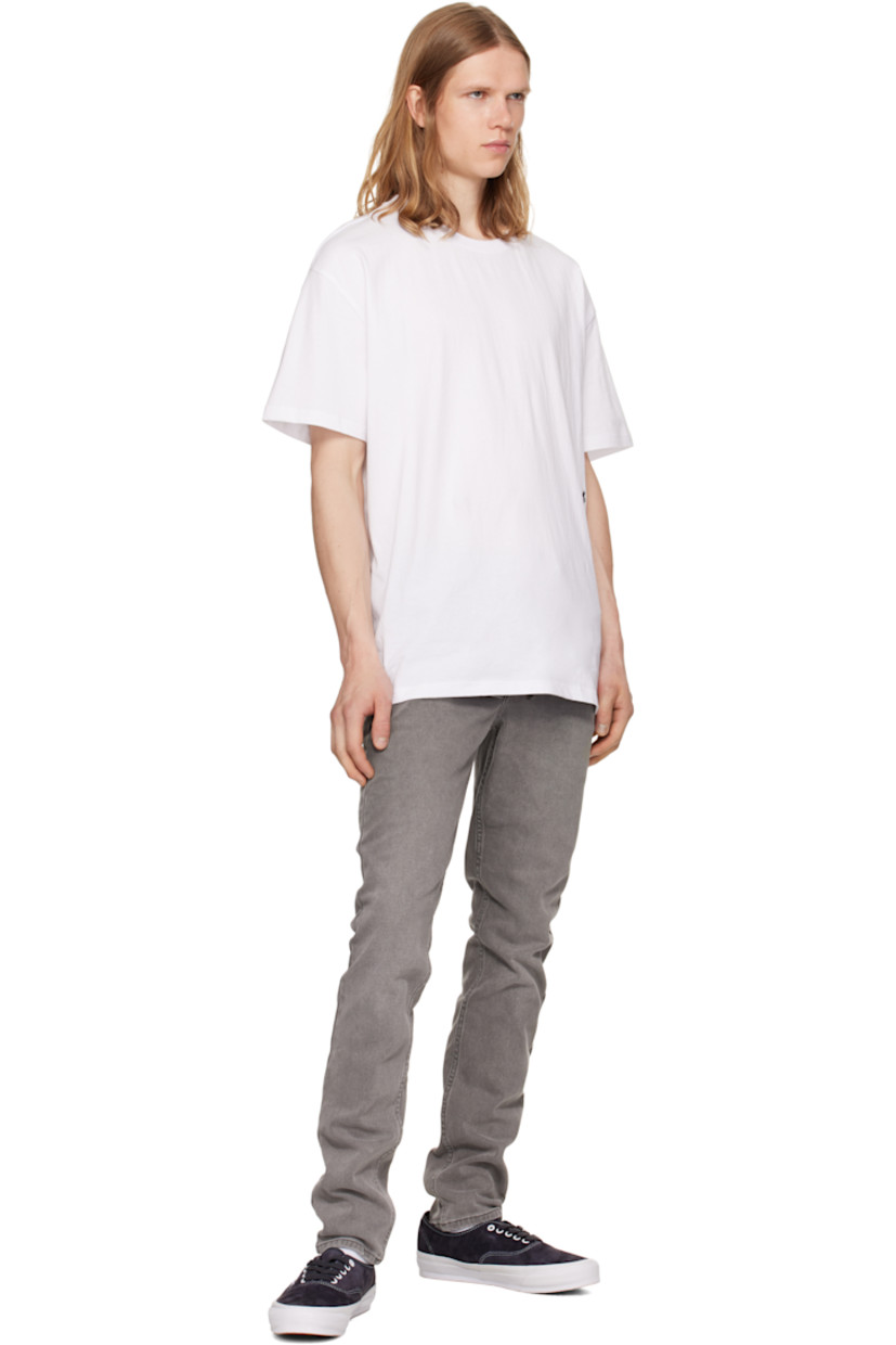 Stretch denim jeans. Fading throughout.

· Slim-fit
· Mid-rise
· Belt loops
· Five-pocket styling
· Button fly
· Logos embroidered at back
· Detachable logo flag at back pocket
· Logo printed at back leg

Supplier color: Prodigy