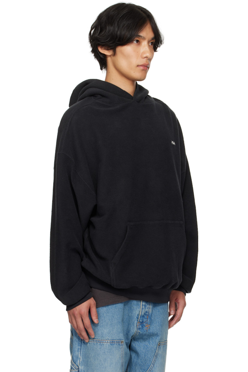 Heavyweight cotton fleece hoodie.

· Logo embroidered at front
· Kangaroo pocket
· Rib-knit hem and cuffs
· Knotted trim at hem
· Dropped shoulders
· Logo embroidered at back

Supplier color: Jet Black