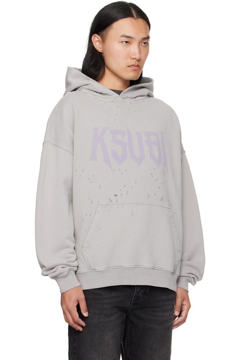 Heavyweight cotton French terry hoodie.

· Dotted distressing throughout
· Faded logo printed at chest
· Rib-knit hem and cuffs
· Dropped shoulders
· Embroidered logos at back hem

Supplier color: Washed grey