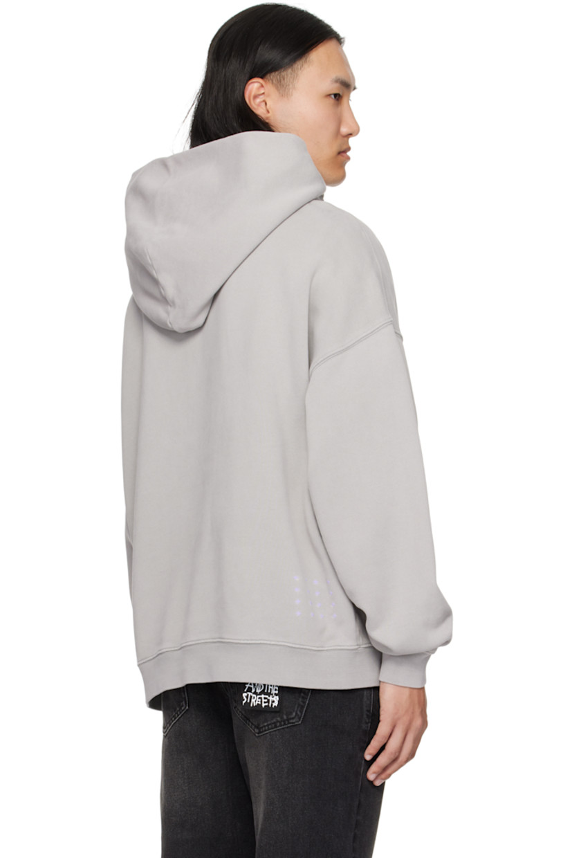 Heavyweight cotton French terry hoodie.

· Dotted distressing throughout
· Faded logo printed at chest
· Rib-knit hem and cuffs
· Dropped shoulders
· Embroidered logos at back hem

Supplier color: Washed grey