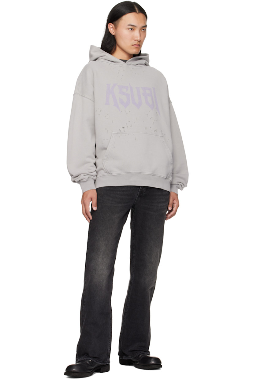 Heavyweight cotton French terry hoodie.

· Dotted distressing throughout
· Faded logo printed at chest
· Rib-knit hem and cuffs
· Dropped shoulders
· Embroidered logos at back hem

Supplier color: Washed grey