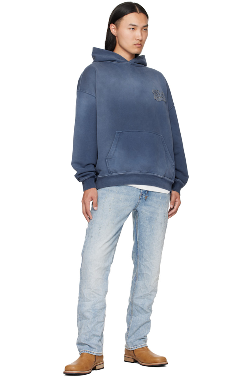 Heavyweight cotton French terry hoodie.

· Fading throughout
· Chenille logo patch at chest
· Kangaroo pocket at waist
· Rib-knit hem and cuffs
· Embroidered logo and text patches at back
· Embroidered logos at back hem

Supplier color: Ink blue
