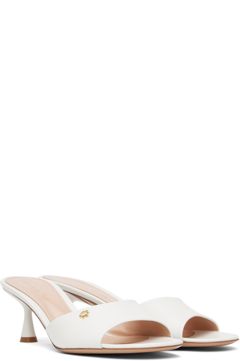 Buffed calfskin mules in white.

· Open toe
· Gold-tone logo hardware at vamp
· Logo printed at leather footbed
· Covered kitten heel with rubber injection
· Polished leather sole
· Heel: H2.5"

Supplier color: White