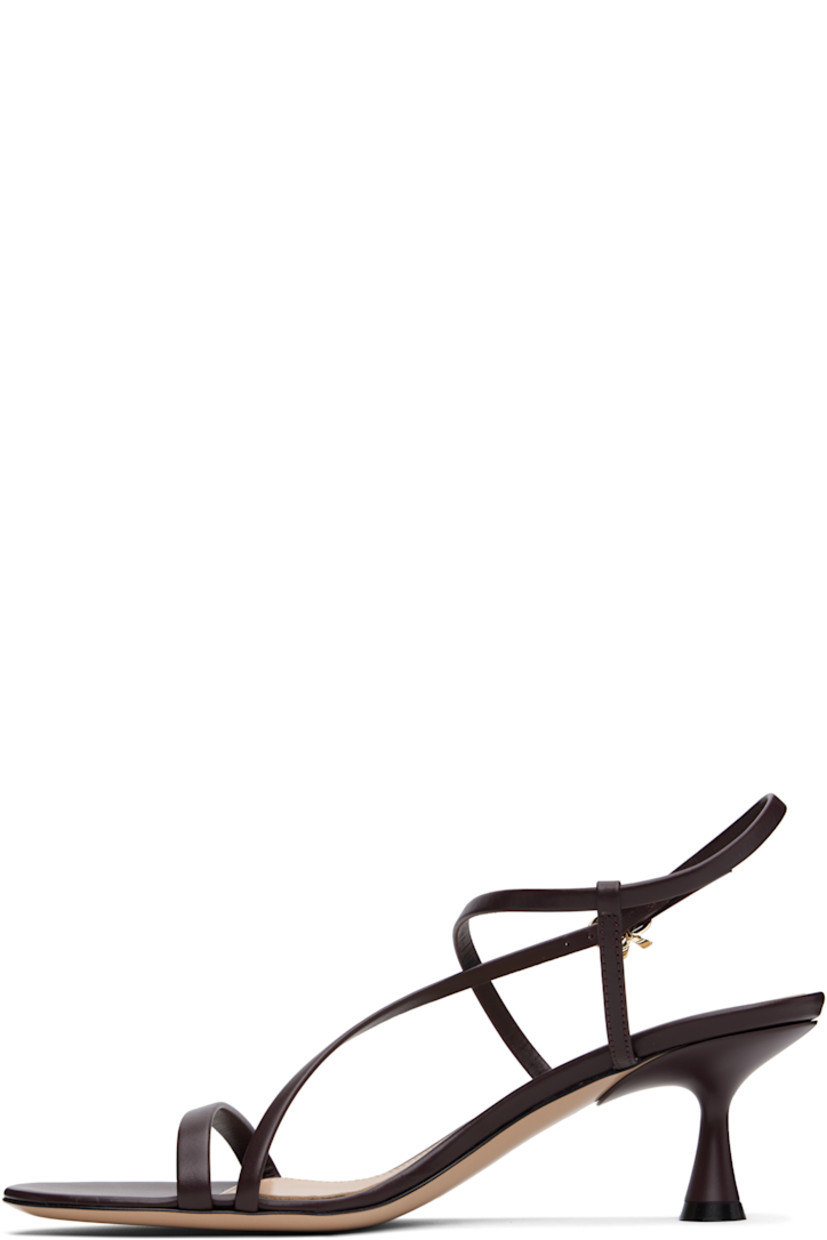 Buffed leather heeled sandals in brown.

· Open toe
· Crisscrossing pin-buckle slingback strap
· Logo stamp at leather footbed
· Covered spool heel with rubber injection
· Polished leather sole
· Heel: H2.5"

Supplier color: Vitello glove bourgogne