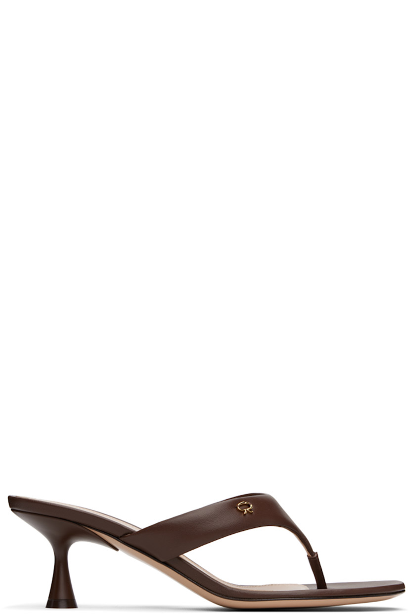 Handcrafted buffed nappa leather heeled sandals in brown. 

· Open toe
· Thong-style strap with logo hardware at vamp
· Logo stamp at leather footbed
· Covered spool heel with rubber injection
· Polished leather sole
· Heel: H2.5"

Supplier color: Nappa brown