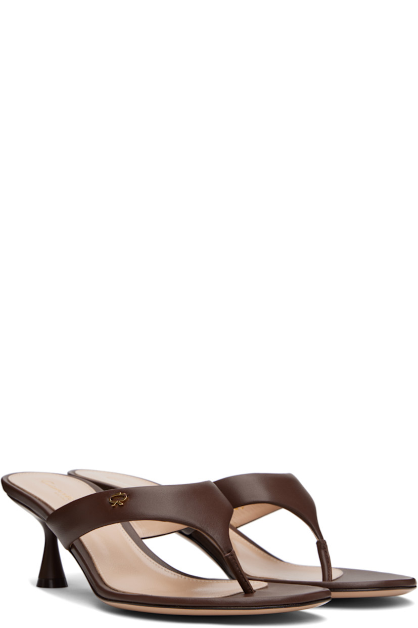 Handcrafted buffed nappa leather heeled sandals in brown. 

· Open toe
· Thong-style strap with logo hardware at vamp
· Logo stamp at leather footbed
· Covered spool heel with rubber injection
· Polished leather sole
· Heel: H2.5"

Supplier color: Nappa brown