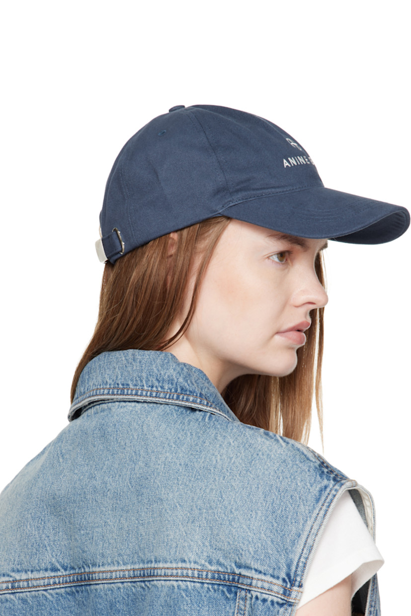 Handcrafted cotton twill cap.

· Embroidered eyelets at crown
· Logo embroidered at face and back
· Curved brim
· Cinch fastening

Supplier color: Dark blue