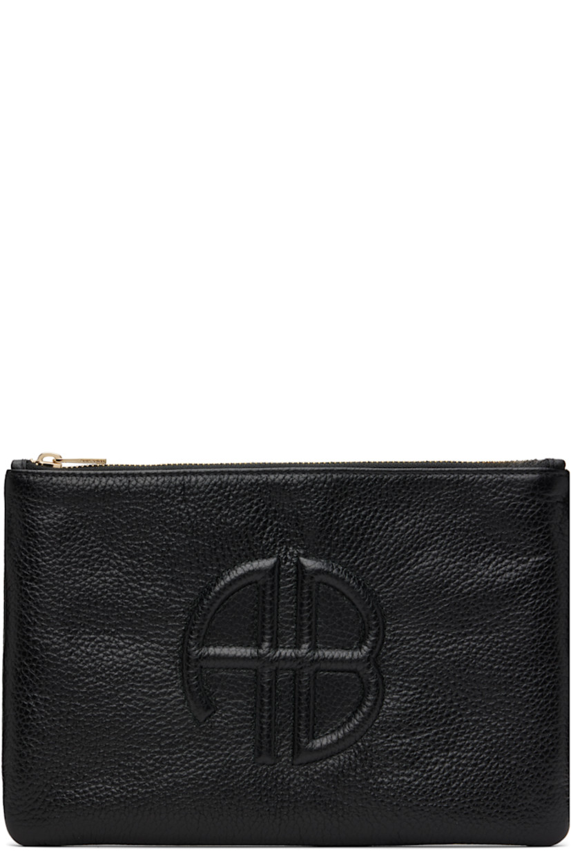 Pebble-grained leather pouch.

· Logo embossed at face
· Zip closure
· Card slot at interior 
· Twill lining
· Logo-engraved gold-tone hardware
· H7" x W10.5" x D0.5"

Supplier color: Black