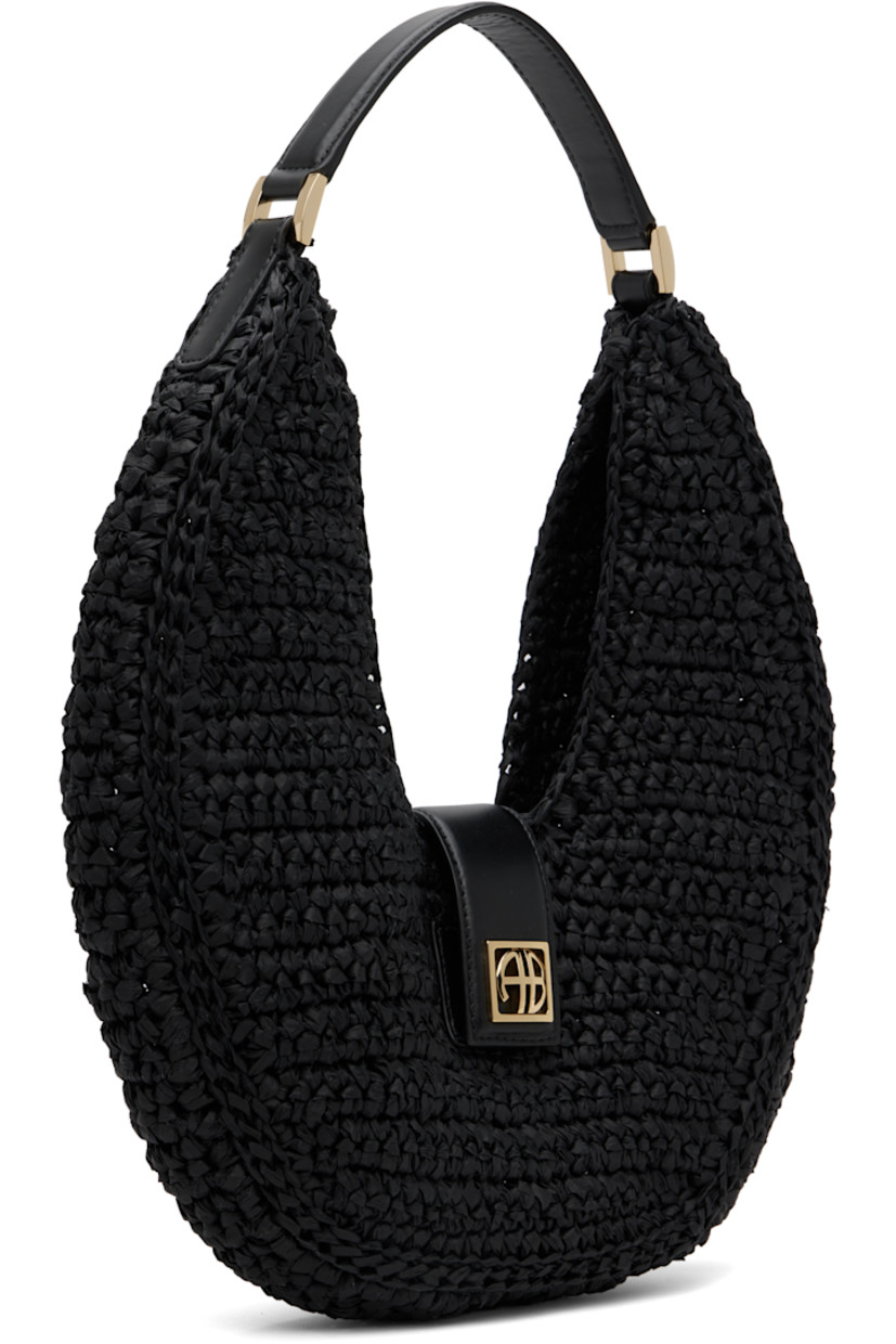 Handcrafted woven cellulose shoulder bag. 

· Buffed leather trim throughout
· Fixed shoulder strap
· Logo hardware at magnetic press-stud tab closure 
· Unlined
· Gold-tone hardware
· H6" x W10.5" x D2"

Supplier color: Black