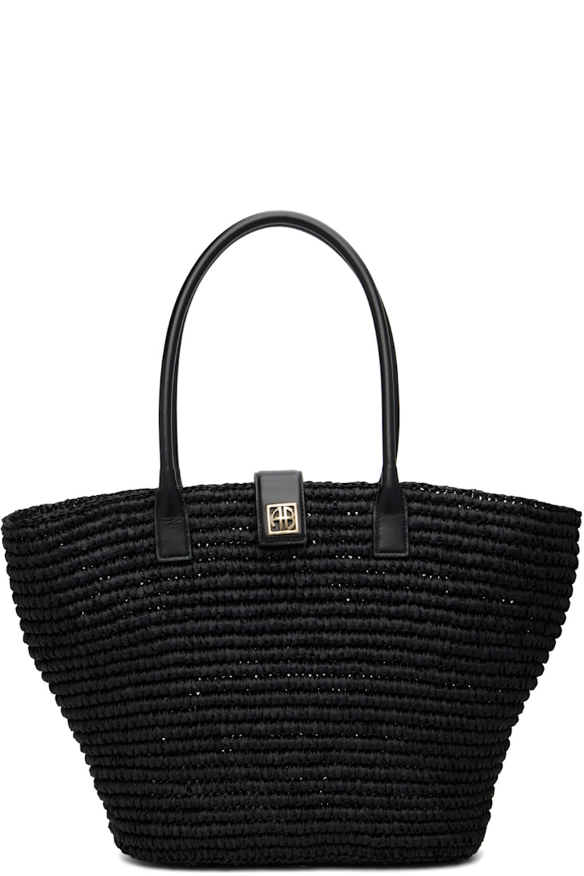 Basket-woven seagrass tote.

· Rolled leather shoulder straps
· Magnetic press-stud tab with logo hardware
· Unlined
· H13" x W20" x D5"

Supplier color: Black