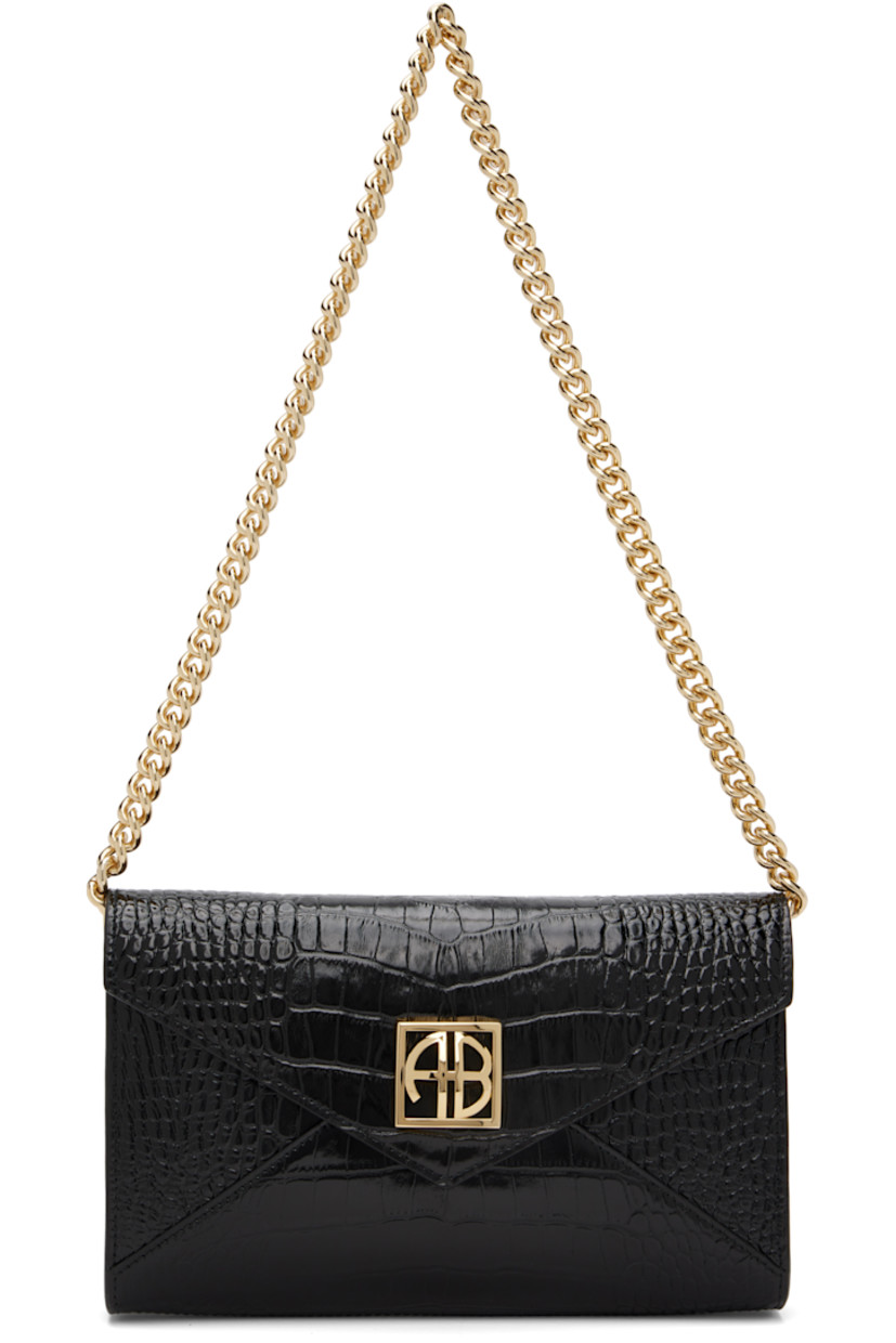 Croc-embossed patent leather clutch.

· Detachable curb chain shoulder strap
· Logo hardware at magnetic press-stud flap
· Card slot at interior 
· Buffed leather lining 
· Gold-tone hardware
· H6" x W9 x D1.75"

Supplier color: Black embossed