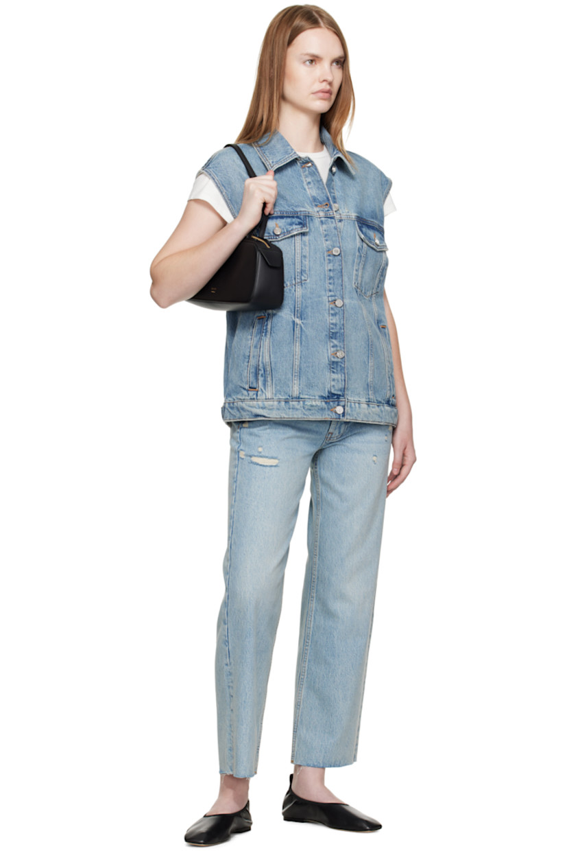 Non-stretch denim vest.

· Fading, whiskering, and subtle distressing throughout 
· Spread collar 
· Button closure
· Flap pockets at chest 
· Welt pockets at waist
· Adjustable button tabs at back hem 
· Logo-engraved silver-tone hardware
· Contrast stitching in tan 

Supplier color: Summer indigo