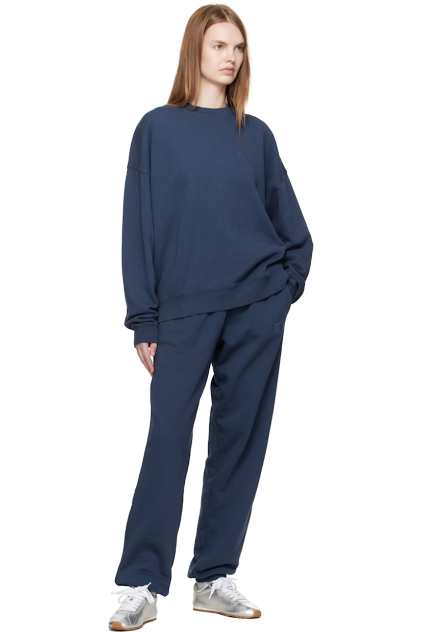 French terry sweatshirt. 

· Rib-knit crewneck, hem, and cuffs
· Logo embroidered at chest
· Dropped shoulders
· Bonded logo at back collar 

Supplier color: Washed navy