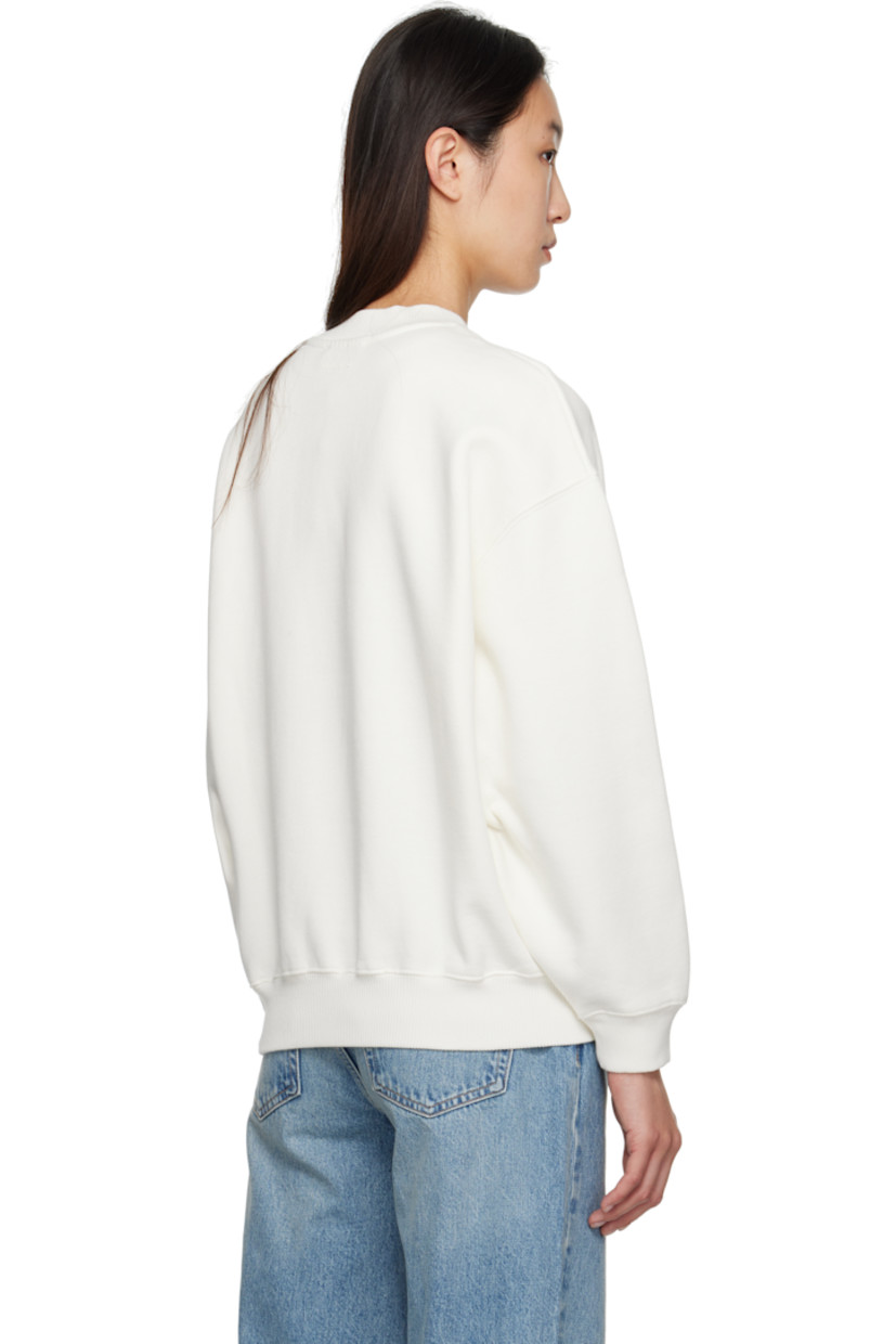 Loose-fit cotton-blend fleece sweatshirt.

· Rib-knit crewneck, hem, and cuffs
· Logo printed at chest
· Dropped shoulders
· Logo bonded at back collar

Supplier color: Ivory