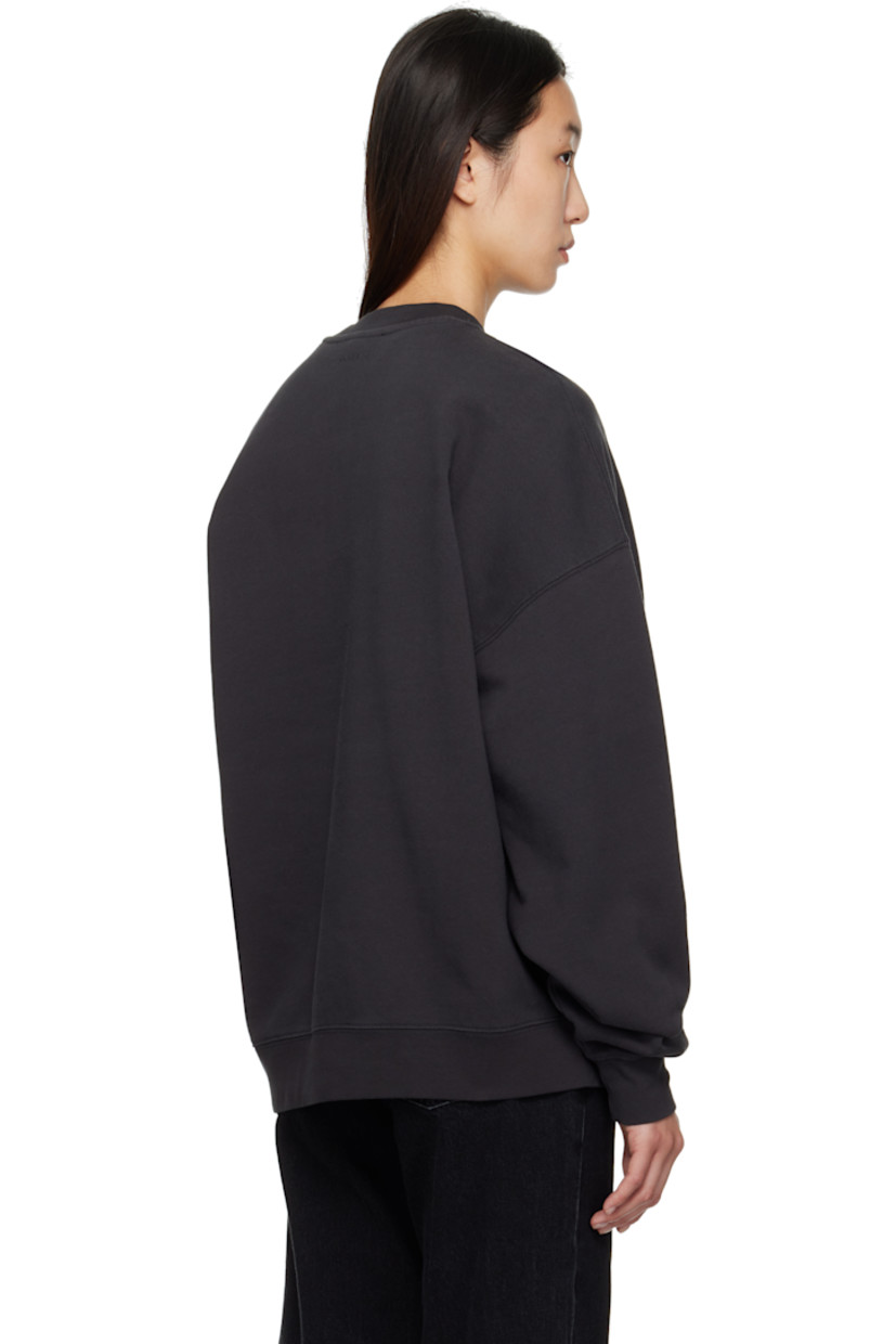 Relaxed-fit organic cotton fleece sweatshirt.

· Rib-knit crewneck, hem, and cuffs
· Logo and text appliqués at front
· Dropped shoulders
· Logo bonded at back collar

Supplier color: Vintage Black